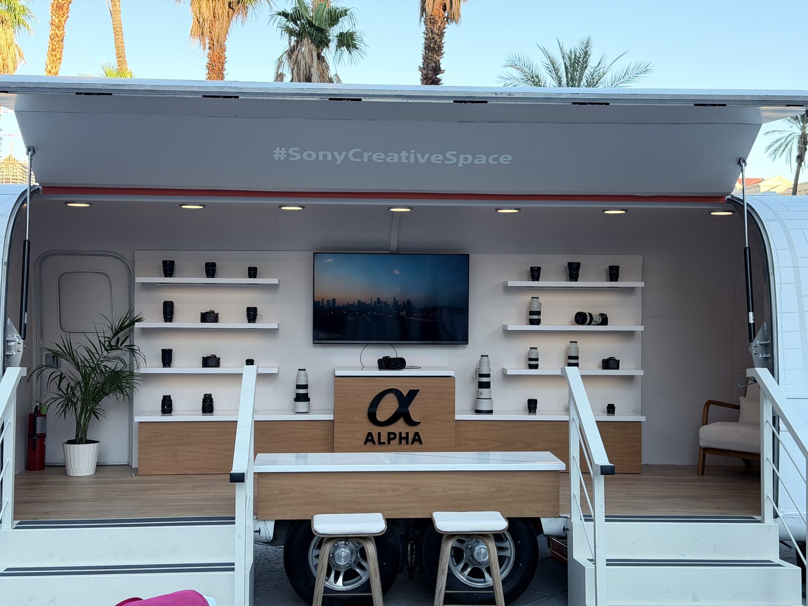 An outdoor event printing booth and trailer setup