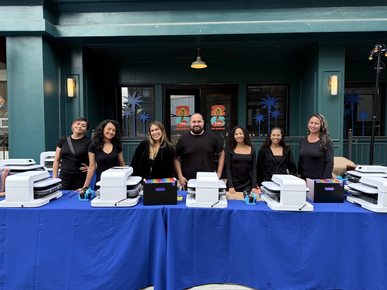 A full-color DTF transfer pressed onto a shirt at an event station